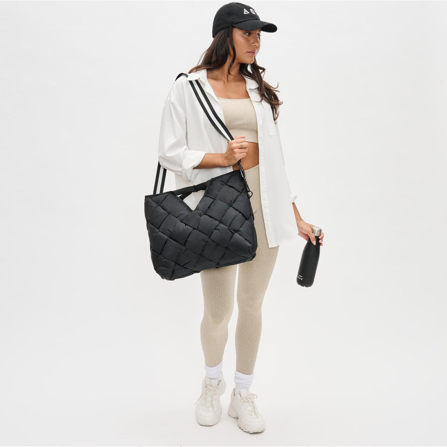 Sol and Selene — Model carrying the black puffer tote