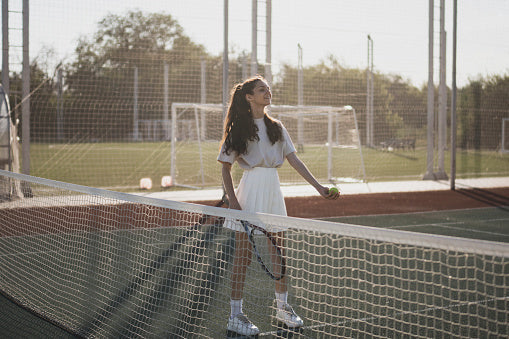 Women playing tennis and pickleball outdoors — why these are the perfect games to start today, by The Court Society