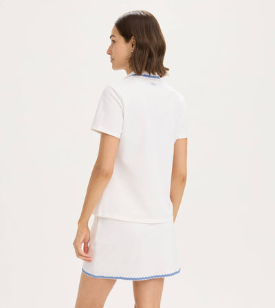 RNWK Ric Rac Performance Tennis Polo — lifestyle view